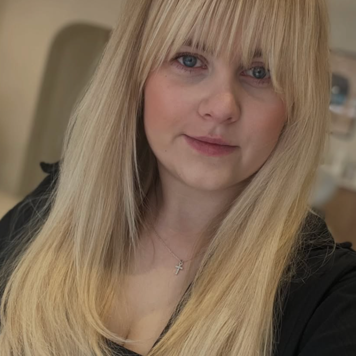 blonde hair with extensions and a fringe